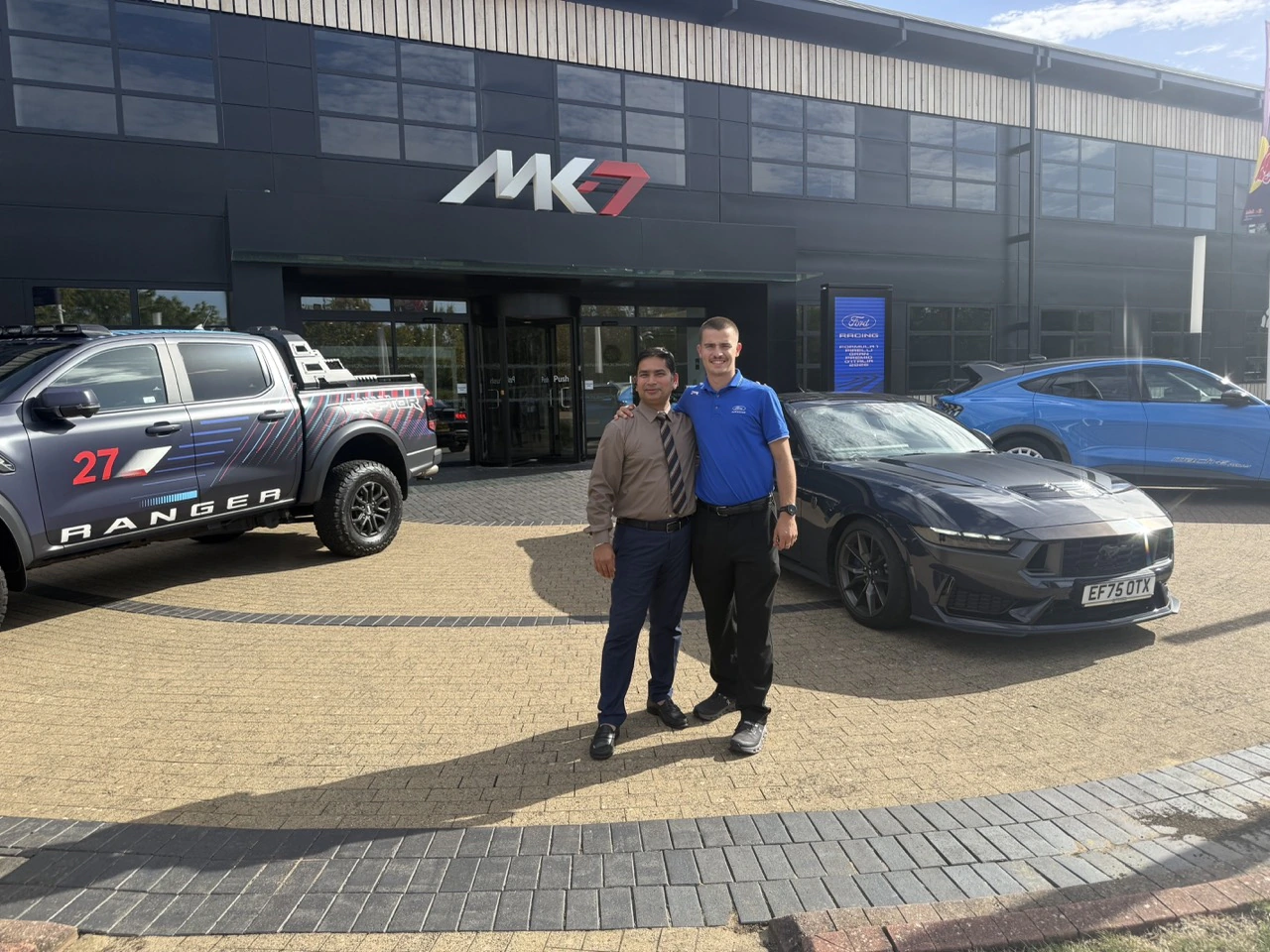 PTG chauffeur with a Ford representative and display vehicles outside MK7 in Milton Keynes